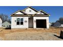 New construction home with vinyl siding and a two-car garage at 150 W Saltgrass Ln, Smithfield, NC 27577