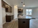 Kitchen with stainless appliances, granite countertops, lots of cabinet space, and a large window for natural light at 160 W Saltgrass Ln, Smithfield, NC 27577