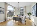 Elegant dining room with hardwood floors and a chandelier, offering city views at 200 S Dawson St # 406, Raleigh, NC 27601