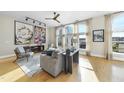 Bright living room featuring hardwood floors and city views from large windows at 200 S Dawson St # 406, Raleigh, NC 27601