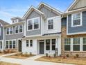 Two-story townhome with gray and white siding, and a gray front door at 310 Church St # 35, Wendell, NC 27591