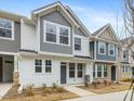 Two-story townhome with gray and white siding, and a gray front door at 310 Church St # 35, Wendell, NC 27591