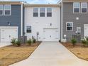 Two-car garage with white doors and landscaping at 310 Church St # 35, Wendell, NC 27591
