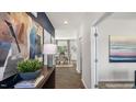 Bright and spacious foyer with hardwood floors, leading to the dining area at 6461 Alfalfa Ln, Wake Forest, NC 27587