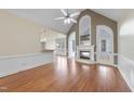 Bright living room features a fireplace, hardwood floors, and ample natural light at 701 Occoneechee Dr, Fuquay Varina, NC 27526