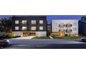 Modern apartment building with parking and balconies at 711 E Lenoir St # 205, Raleigh, NC 27601