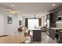 Open concept kitchen with island and modern appliances at 711 E Lenoir St # 205, Raleigh, NC 27601