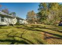 Spacious backyard with mature trees, offering privacy at 1026 Nashville Rd, Rocky Mount, NC 27803