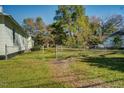 Large backyard with a chain link fence, providing ample space at 1026 Nashville Rd, Rocky Mount, NC 27803