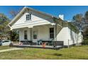 White house with a covered porch, offering curb appeal at 1026 Nashville Rd, Rocky Mount, NC 27803