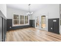 Bright dining room with hardwood floors and French doors leading to the backyard at 1040 Southern High School Rd, Burlington, NC 27215