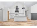 Bright, modern kitchen with white cabinets, subway tile backsplash, and spacious island at 1040 Southern High School Rd, Burlington, NC 27215