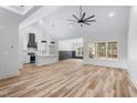 Open-concept living space with high ceilings, wood floors, and an abundance of natural light at 1040 Southern High School Rd, Burlington, NC 27215