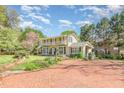 Inviting two-story home with manicured front yard and brick-paved driveway at 110 E Orange St, Hillsborough, NC 27278