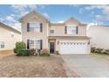 Charming two-story home with attached two-car garage at 112 Smith Rock Dr, Holly Springs, NC 27540
