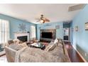 Spacious living room with fireplace and large sectional sofa at 112 Smith Rock Dr, Holly Springs, NC 27540