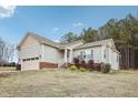House exterior showcasing landscaping and driveway at 165 Turlington Rd, Dunn, NC 28334
