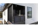 Private balcony with metal railings and exterior lighting at 2201 Millbank Village Ct # 101, Raleigh, NC 27610