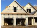 View of exterior framing and construction with a clear blue sky backdrop at 35 Hewitt Wds Dr, Clayton, NC 27527