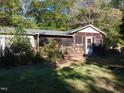 Single story home with a screened porch and deck at 3722 Durham Rd, Raleigh, NC 27614