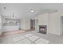Open living room with kitchen, fireplace and hardwood floors at 4024 Claret Ln, Morrisville, NC 27560