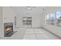 Bright living room with fireplace, vaulted ceiling and sliding glass door to balcony at 4024 Claret Ln, Morrisville, NC 27560