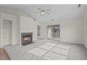 Living room features a fireplace and sliding door to balcony at 4024 Claret Ln, Morrisville, NC 27560
