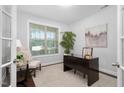 Bright home office with built-in desk and hardwood floors at 4052 Truelove Dr, Apex, NC 27539