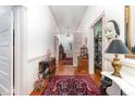 Long hallway with hardwood floors and unique wall decor at 517 N East St, Raleigh, NC 27604