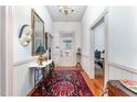 Bright hallway with hardwood floors and access to multiple rooms at 517 N East St, Raleigh, NC 27604