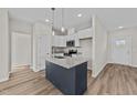 Modern kitchen with granite countertops and kitchen island at 75 Brookhaven Dr, Spring Hope, NC 27882