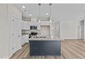 Modern kitchen with granite countertops and kitchen island at 75 Brookhaven Dr, Spring Hope, NC 27882