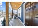 Bright and airy front porch with rocking chair and wooden flooring at 819 Cumberland St, Raleigh, NC 27610