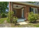 Covered porch with ceiling fan and access to backyard at 945 Sycamore St, Rocky Mount, NC 27801