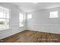 Formal dining room with hardwood floors and wainscoting at 91 Priming Way, Angier, NC 27501