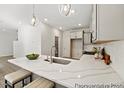 Kitchen island with white quartz countertop and modern sink at 100 Summer Mist Ln # 163P, Clayton, NC 27527