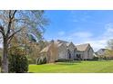 Beautifully maintained brick home with lush lawn and mature trees in a serene setting at 101 Bonica Creek Dr, Garner, NC 27529