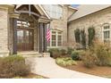 Inviting front entrance with detailed wood doors and landscaped garden at 101 Bonica Creek Dr, Garner, NC 27529