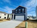 Beautiful navy blue two-story home with a 2 car garage in a Gathering neighborhood at 110 Gabriel Ct, Clayton, NC 27520