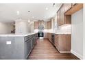 Well-equipped kitchen with granite countertops, stainless steel appliances, and a large center island at 1975 Meadowview Dr, Graham, NC 27253