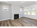 Living room featuring a fireplace and hardwood floors at 290 Beacon Dr, Pittsboro, NC 27312