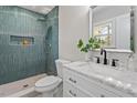Modern bathroom features stylish tiled shower, sleek vanity, and a large mirror at 3305 Victor Pl, Raleigh, NC 27604