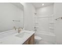 Bright bathroom featuring a shower-tub combo, white countertops, and bronze fixtures at 4717 Cypress Tree Ln, Raleigh, NC 27612
