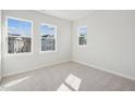 Well lit bedroom with three windows offering neighborhood views at 4717 Cypress Tree Ln, Raleigh, NC 27612