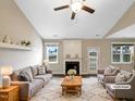 Spacious living room with fireplace and virtually staged furniture at 55 Oxer Dr, Youngsville, NC 27596