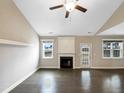 Bright living room featuring hardwood floors and a fireplace at 55 Oxer Dr, Youngsville, NC 27596