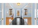 Bright entryway with hardwood floors and a view to the backyard at 5765 G Snow Camp Rd, Graham, NC 27253