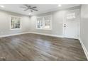 Bright living room featuring hardwood floors and lots of natural light at 6307 Tryon Rd, Cary, NC 27518