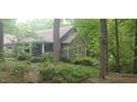 House exterior showcasing stonework and landscaping at 7115 Laurel Point Dr, Gibsonville, NC 27249