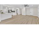 Open concept living and kitchen area with hardwood floors at 919 Fiske St, Durham, NC 27703